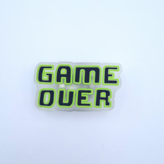 Crocs Button mit LED Beleuchtung und Game Over Motiv.